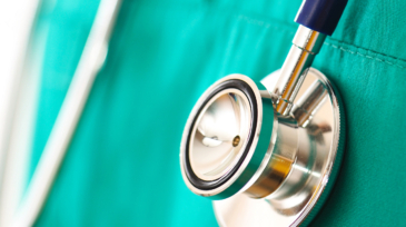 Surgeon doctor holding his stethoscope