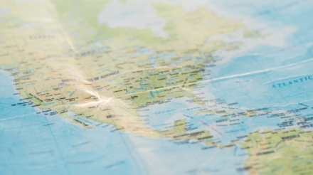 Selective focus of american continents on world map