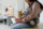 Close-up of little girl sitting on couch with toy during her visit to pediatrician in hospital